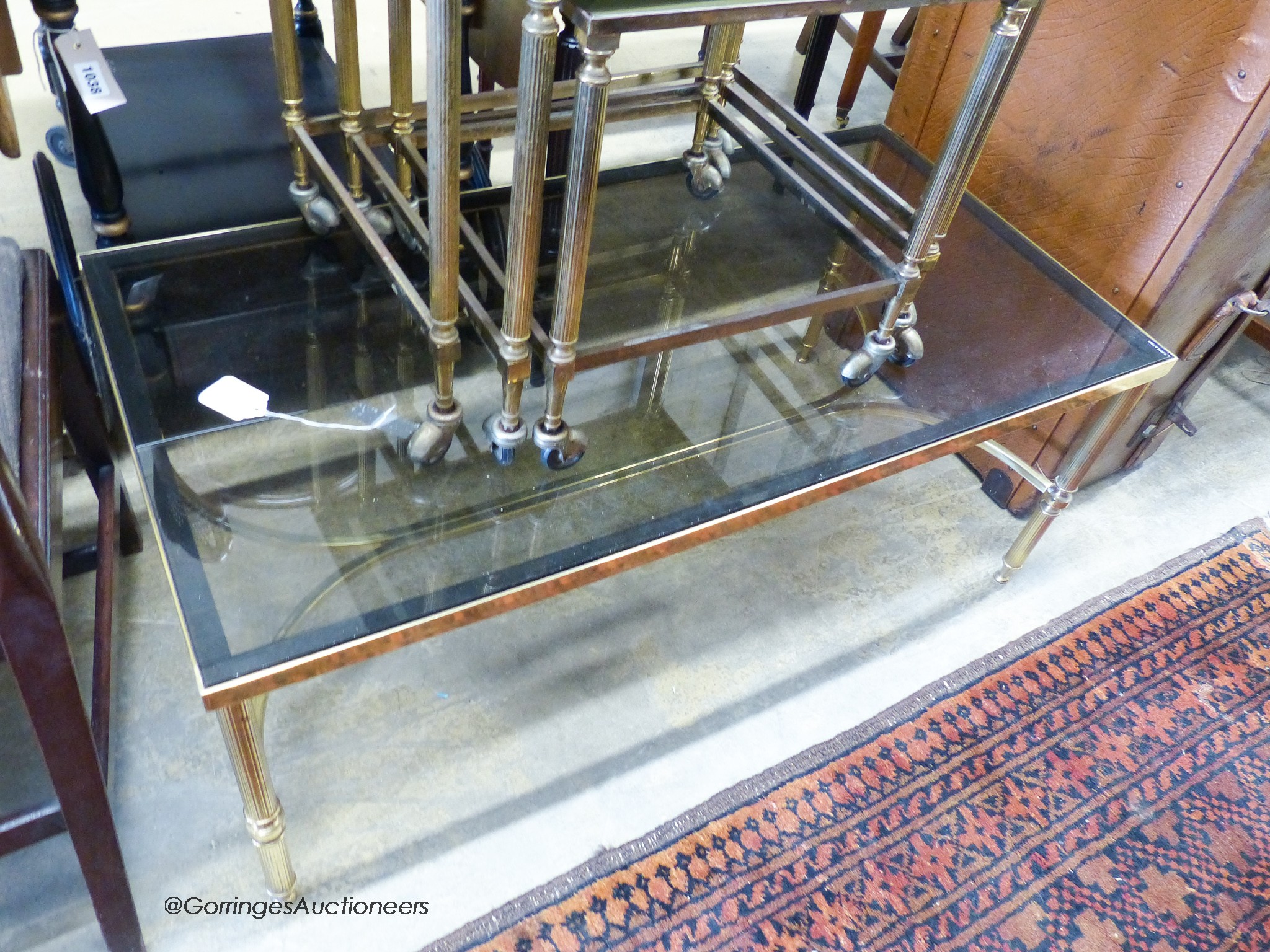 Two nests of gilt metal and glass tables and a similar coffee table.